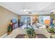 Living room with water views, comfy sofas, and ceiling fan at 800 Madonna Blvd # B, Tierra Verde, FL 33715