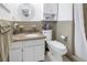 Small bathroom with granite vanity and shower at 800 Madonna Blvd # B, Tierra Verde, FL 33715