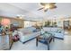 Living area featuring light sofas and a coffee table at 800 Madonna Blvd # B, Tierra Verde, FL 33715