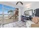 Sunroom with water view, home office, and patio access at 800 Madonna Blvd # B, Tierra Verde, FL 33715