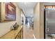 A light hallway with views into the living room and kitchen at 800 Madonna Blvd # B, Tierra Verde, FL 33715