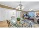 Dining area with glass-top table and access to living room at 800 Madonna Blvd # B, Tierra Verde, FL 33715