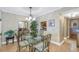 Bright dining area with glass-top table and chandelier at 800 Madonna Blvd # B, Tierra Verde, FL 33715