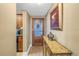 Bright entryway with wood flooring, decorative console table, and access to kitchen at 800 Madonna Blvd # B, Tierra Verde, FL 33715