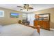 Main bedroom with large TV and comfortable seating area at 800 Madonna Blvd # B, Tierra Verde, FL 33715
