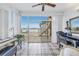 Sunroom with water view, workspace and access to patio at 800 Madonna Blvd # B, Tierra Verde, FL 33715