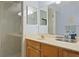Bathroom features double vanity and a glass shower at 10823 Indian Hills Ct # 33, Seminole, FL 33777