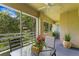 Relaxing screened balcony overlooking lush greenery at 10823 Indian Hills Ct # 33, Seminole, FL 33777