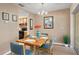 Bright dining room with table and chairs, kitchen view at 10823 Indian Hills Ct # 33, Seminole, FL 33777