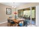 Cozy dining area with a table for four and access to a balcony at 10823 Indian Hills Ct # 33, Seminole, FL 33777