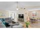 Open living room with sectional sofa and adjacent dining area at 10823 Indian Hills Ct # 33, Seminole, FL 33777