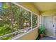 Enjoy the view from this screened balcony with lush landscaping at 10823 Indian Hills Ct # 33, Seminole, FL 33777