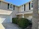 Two-story house with a garage and landscaping at 15529 Redington Dr, Redington Beach, FL 33708