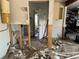 Unfinished bathroom with toilet and damaged walls at 15529 Redington Dr, Redington Beach, FL 33708