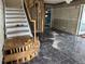 Under construction entryway with staircase and tile flooring at 15529 Redington Dr, Redington Beach, FL 33708