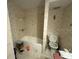 Small bathroom with shower/tub combo and linoleum floor at 15529 Redington Dr, Redington Beach, FL 33708