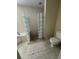 Bathroom with glass block shower and tile flooring at 15529 Redington Dr, Redington Beach, FL 33708