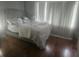 Spacious bedroom with large windows and hardwood floors at 7505 Pitch Pine Cir # 123, Tampa, FL 33617