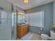 Updated bathroom with granite vanity and shower at 18 Heilwood St, Clearwater Beach, FL 33767