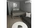 Comfortable bedroom with a queen bed and additional seating at 18 Heilwood St, Clearwater Beach, FL 33767