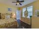 Bedroom with floral bedding and large dresser at 18 Heilwood St, Clearwater Beach, FL 33767