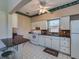 Kitchen with granite countertops and white cabinets at 18 Heilwood St, Clearwater Beach, FL 33767