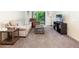 Living room with beige couch, recliner, coffee table and TV stand at 1354 Azalea Dr # 1803, Dunedin, FL 34698