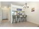 Kitchen with breakfast bar, light-colored cabinets, and neutral tile flooring at 1354 Azalea Dr # 1803, Dunedin, FL 34698