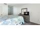 Main bedroom with dresser and TV at 1354 Azalea Dr # 1803, Dunedin, FL 34698