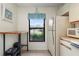 Small kitchen area with a microwave and refrigerator at 1354 Azalea Dr # 1803, Dunedin, FL 34698