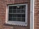 Close-up of a window with blinds on a brick building at 3838 37Th S St # 57, St Petersburg, FL 33711