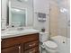 Clean bathroom with tub, shower, and dark brown vanity at 9309 Rally Spring Loop, Wesley Chapel, FL 33545