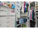 Spacious walk-in closet with ample shelving and hanging space at 9309 Rally Spring Loop, Wesley Chapel, FL 33545