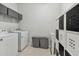 Laundry room with washer, dryer, and additional storage at 9309 Rally Spring Loop, Wesley Chapel, FL 33545