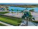 Resort-style pool with sandy beach and palm trees at 9309 Rally Spring Loop, Wesley Chapel, FL 33545