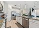 Modern kitchen with stainless steel appliances and granite countertops at 9309 Rally Spring Loop, Wesley Chapel, FL 33545