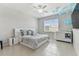 Bright bedroom featuring a king-size bed and ample space at 9309 Rally Spring Loop, Wesley Chapel, FL 33545