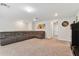 Spacious bonus room with large sectional sofa and neutral carpeting at 9309 Rally Spring Loop, Wesley Chapel, FL 33545