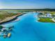 Stunning aerial view of the lagoon pool and beach at 9309 Rally Spring Loop, Wesley Chapel, FL 33545