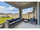 Relaxing screened patio with seating area and view of backyard at 9309 Rally Spring Loop, Wesley Chapel, FL 33545