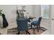 Home office with two comfortable chairs and a modern standing desk at 9309 Rally Spring Loop, Wesley Chapel, FL 33545