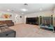 Bonus room featuring a large sectional sofa, TV, and mini trampoline at 9309 Rally Spring Loop, Wesley Chapel, FL 33545