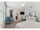 Bedroom with a walk-in closet and en-suite bathroom at 9309 Rally Spring Loop, Wesley Chapel, FL 33545