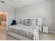 Spacious bedroom with a large bed and ensuite bathroom at 9309 Rally Spring Loop, Wesley Chapel, FL 33545