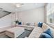 Relaxing living room with sectional sofa and ottoman at 9309 Rally Spring Loop, Wesley Chapel, FL 33545