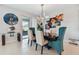 Elegant dining room with a modern chandelier and stylish decor at 9309 Rally Spring Loop, Wesley Chapel, FL 33545