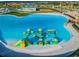 Aqua park with inflatable obstacles in lagoon pool at 9309 Rally Spring Loop, Wesley Chapel, FL 33545