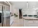 Kitchen features stainless steel appliances and an island at 9309 Rally Spring Loop, Wesley Chapel, FL 33545