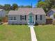 House exterior with teal door and manicured lawn at 4320 3Rd N Ave, St Petersburg, FL 33713