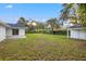 Expansive backyard featuring a storage shed, mature trees, and ample space for outdoor activities at 508 Brooker Rd, Brandon, FL 33511